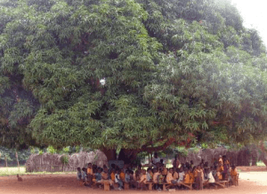A school under tree somewhere in Ghana.