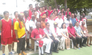 Chinese Ambassador, Mrs Sun Baohong, and basketball players.