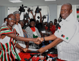 Vice President Amissah-Arthur (left) presenting the forms to Aseidu Nketsia