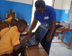 Primary 5 pupil touching the computer for the first time