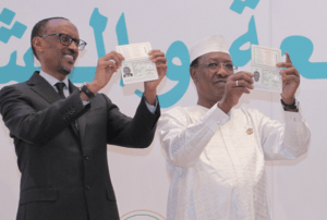 Presidents Kagame (right) and Debby (left) displaying their passports.