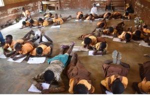 Bukunor pupils lie on floor to write examination